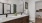 bathroom with a large mirror and closet in the background