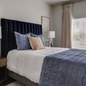 Sleep in style bedroom with a bed and large window