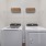 laundry area with shelving and a washer and dryer